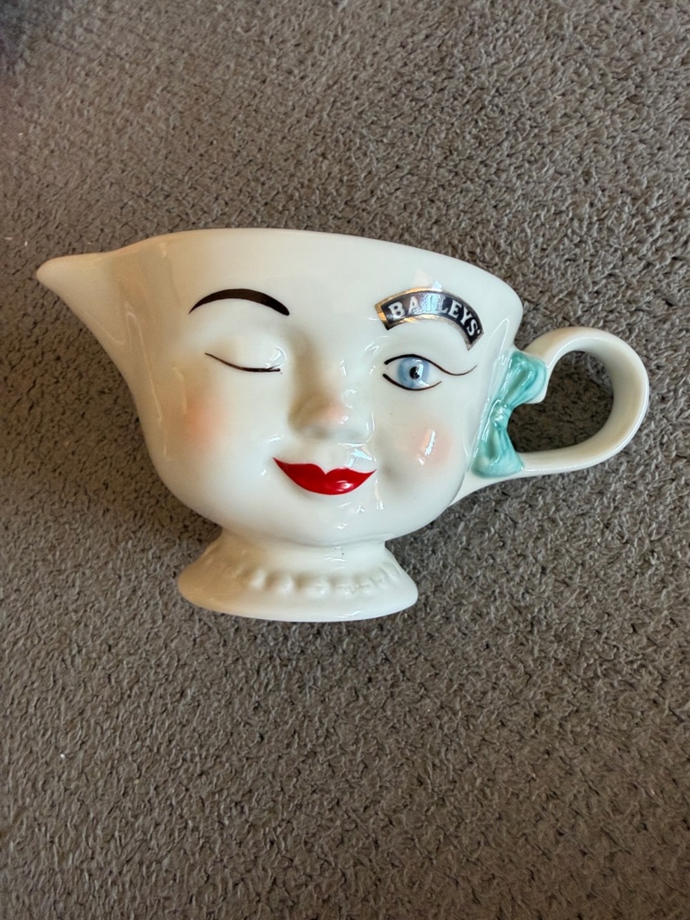 White Ceramic Winking Face Creamer with Red Lips